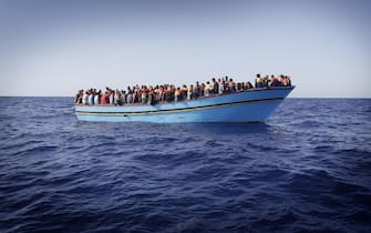 Alcuni profughi di origine Subsahariana soccorsi dall'equipaggio della Fregata Euro a bordo di un'imbarcazione durante l'operazione Mare Nostrum nel Mar Mediterraneo Meridionale 31 Agosto 2014. ANSA/GIUSEPPE LAMI