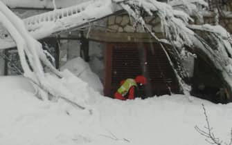 The handout first pictures provided by Italian National Alpine Cliff and Cave Rescue Corps (CNAS) taken this morning at dawn at hotel Rigopiano, in Abruzzo region, overwhelmed yesterday by a snow's avalanche. Farindola (Pescara), Jan. 19, 2017. The CNAS' technicians arrived on the scene with skis on their feet and extracted the first victim from the rubble. ANSA/  CNSAS PRESS OFFICE +++ ANSA PROVIDES ACCESS TO THIS HANDOUT PHOTO TO BE USED SOLELY TO ILLUSTRATE NEWS REPORTING OR COMMENTARY ON THE FACTS OR EVENTS DEPICTED IN THIS IMAGE; NO ARCHIVING; NO LICENSING +++
