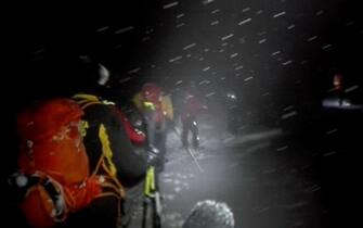 A video grab sent by the rescuers column during the night journey to the hotel Rigopiano, Abruzzo region, overwhelmed yesterday by a snow's avalanche, sent by rescuers arrived at the scene. Farindola (Pescara), Jan. 19, 2017. According to the Abruzzo mountain rescue there would be many deaths. ANSA/