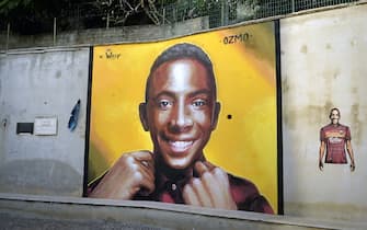 It was the night of 6 September 2020 when Willy Monteiro Duarte, a 21-year-old of Cape Verdean origins, was brutally killed in Colleferro, in the province of Frosinone, during a beating at the hands of four peers. A horrendous black news page which includes prevarication, delinquency and racial hatred, which has been on fire for press and social days. Thanks to an initiative promoted by Vanity Fair, Willy's memory is now celebrated with a large mural in Piazzale Aldo Moro, a meeting point in the historic center of Paliano, where the boy lived. To create the work - inaugurated on the evening of September 15 - Ozmo, one of the most famous Italian street artists, who told the genesis of his latest work on his Facebook page.Paliano (Rome) Italy, September 20th, 2020
(Photo by Rocco Spaziani) | usage worldwide