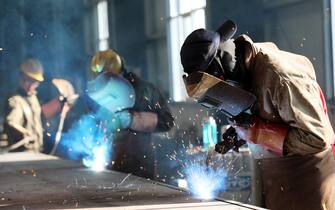 This photo taken on May 3, 2018 shows a worker cutting steel at a factory in Huaibei in China's eastern Anhui province. - China's surplus with the United States widened in April, underlining an imbalance between the economic titans as they struggle to reach an agreement on averting a potentially damaging trade war. (Photo by - / AFP) / China OUT        (Photo credit should read -/AFP via Getty Images)