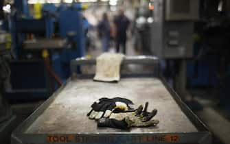 READING, PA - OCTOBER 19:  Work gloves are viewed on the factory floor at Quadrant, a high end plastic processor on October 19, 2011 in Reading, Pennsylvania. Quadrant, a 70 year old company, employs more than 2000 people in 20 countries and is one of the few remaining manufacturers in the area to still provide stable jobs in an uncertain economy. Reading, a city that once boasted numerous industries and the nation's largest railroad company, has recently been named America's poorest city with residents over 65,000. According to new census data, 41.3 percent of people live below the poverty line in Reading. Reading has about 90,000 residents, many of whom are recent Hispanic arrivals who have moved from larger eastern cities over the past decade. While a manufacturing base offering well paying jobs still exists in Reading, many companies like Hershey, Stanley Tool and Dana Systems have either moved elsewhere in the United States or to Mexico in search of cheaper labor. The number of people living in poverty in America, 46.2 million, is now at its highest level for the 52 years the Census Bureau has been keeping records.  (Photo by Spencer Platt/Getty Images)