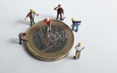 BERLIN, GERMANY - DECEMBER 15: In this photo illustration plastic, toy construction workers stand around a one Euro coin on December 15, 2010 in Berlin, Germany. European leaders are scheduled to meet at a European Union summit in Brussels tomorrow to discuss measures on how to stabilize the Euro that could include the creation of a permanent eurozone bailout system. The Euro has come under severe strain in the last year through the economic problems of some of its members, and a group of nations nicknamed the PIIGS (Portugal, Ireland, Italy, Greece and Spain) have been named by many analysts as the countries posing the biggest threat to the common currency's stability. (Photo Illustration by Sean Gallup/Getty Images)