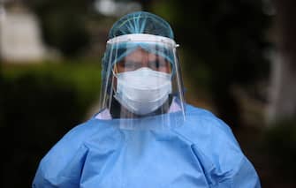 LIMA, PERU - JUNE 25: A nurse wearing protective gear poses at Victor Larco Herrera Mental Hospital on June 25, 2020 in Lima, Peru. Tests carried at the largest mental hospital in Peru confirmed that 162 of of 342 patients and 121 workers were infected with COVID-19. Authorities informed 95 patients have already recovered. Peru is the second worst-hit country in Latin America with 264.689 positive cases, only after Brazil. (Photo by Raul Sifuentes/Getty Images)