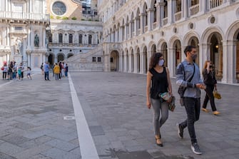 VENICE, ITALY - JUNE 13: Tourists enter the Doge's Palace, which reopened today on June 13, 2020 in Venice, Italy. The whole country is returning to normality after more than two months of a nationwide lockdown meant to curb the spread of Covid-19. (Photo by Stefano Mazzola/Awakening/Getty Images)