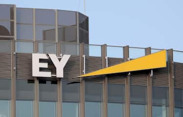 epa08509258 The logo of multinational assurance services giant Ernst & Young (EY) hangs on the facade of a building in Berlin, Germany, 25 June 2020. According to media reports, German payment processor and financial services provider Wirecard AG filed for insolvency on 25 June following revelations that 1.9 billion euros (2.13 billion US dollars) had gone 'missing.' Wirecard share prices collapsed, a criminal investigation was launched and the company's former CEO was arrested. EY, which had audited Wirecard's balance sheets for years, is now facing a slew of lawsuits and business losses after this massive blow to is reputation.  EPA/HAYOUNG JEON