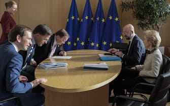 Heads of self-styled "frugal" nations (LtoR) Austria's Chancellor Sebastian Kurz, Netherlands' Prime Minister Mark Rutte, Sweden's Prime Minister Stefan Lofven, Denmark's Prime Minister Mette Frederiksen (up L), President of the European Council Charles Michel and President of the European Commission Ursula von der Leyen meet on the sidelines of a special European Council summit in Brussels on February 20, 2020, held to discuss the next long-term budget of the European Union (EU). (Photo by Virginia Mayo / POOL / AFP) (Photo by VIRGINIA MAYO/POOL/AFP via Getty Images)