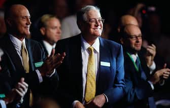 WASHINGTON, DC - NOVEMBER 04:  Americans for Prosperity Foundation chairman and  Koch Industries Executive Vice President David H. Koch (C) listens to speakers during the Defending the American Dream Summit at the Washington Convention Center November 4, 2011 in Washington, DC. The conservative political summit is organized by Americans for Prosperity, which was founded with the support of Koch and his brother David H. Koch.  (Photo by Chip Somodevilla/Getty Images)