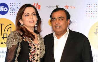 Chairman of Reliance Industries Mukesh Ambani with his Wife Nita Ambani attend the Jio MAMI 18th Mumbai Film Festival opening ceremony at the Royal Opera House, which was being re-launched after 23 years, in Mumbai on October 20, 2016. / AFP / -        (Photo credit should read -/AFP via Getty Images)