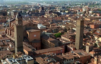 BOLOGNA, ITALY - MARCH 30: The Metropolitan Cathedral of San Pietro, la Cattedrale Metropolitana di San Pietro, is seen with the Torre Azzoguidi (L) in front of its bell-tower on March 30, 2017 in Bologna, Italy. As many as 180 towers are believed to have been built between the 12th and the 13th centuries but only a few remain standing today. (Photo by David Silverman/Getty Images)