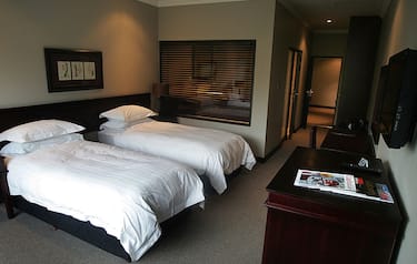 This picture taken on May 13, 2010 shows a bedroom at the Leriba Lodge in Pretoria. The hotel will be the base camp for Italy's national football team during the World cup 2010 in South Africa. AFP PHOTO PABALLO THEKISO (Photo credit should read PABALLO THEKISO/AFP via Getty Images)