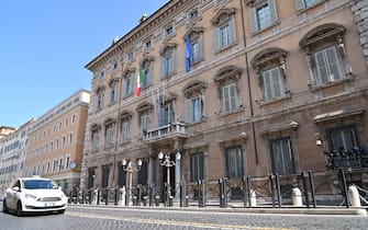 The Italian flag and the flag of Europe fly at half-mast on Palazzo Madama Senate building in Rome on March 31, 2020 as flags are being flown at half-mast in cities across Italy to commemorate the victims of the virus, during the country's lockdown aimed at curbing the spread of the COVID-19 infection, caused by the novel coronavirus. (Photo by ANDREAS SOLARO / AFP) (Photo by ANDREAS SOLARO/AFP via Getty Images)