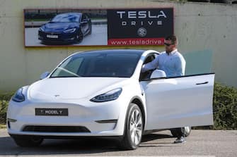 A picture taken on September 5, 2020 shows a driver testing a "Tesla Model Y" car, an all-electric compact SUV by US electric car giant Tesla, during its presentation at the Automobile Club in Budapest. (Photo by ATTILA KISBENEDEK / AFP) (Photo by ATTILA KISBENEDEK/AFP via Getty Images)