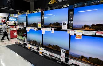 TOKYO, JAPAN - JUNE 05:  A customer walks near OLED (organic light-emitting diode) televisions at the Bic Camera Yurakucho electronics store on June 5, 2018 in Tokyo, Japan. The store is one of the most profitable electronic, cosmetic and duty-free goods stores in Japan and is a popular destination among increasing in-bound tourists to the country. A record 28.7 million tourists visited Japan in 2017, up 19 percent from the previous year.  (Photo by Tomohiro Ohsumi/Getty Images)