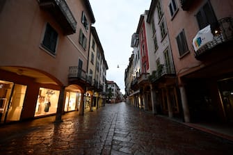 VARESE, ITALY - APRIL 28:  Shopping streets are deserted in the city centre of Vernise due to corona restrictions on April 28, 2020 in Varese, Italy. Italy will remain on lockdown to stem the transmission of the Coronavirus (Covid-19), slowly easing restrictions. (Photo by Mattia Ozbot/Soccrates Images/Getty Images)