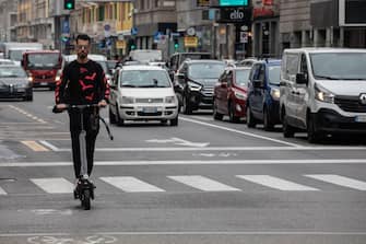 MILAN, ITALY - SEPTEMBER 23: A man rides an electric scooter on a pop-up bike lane on Corso Buenos Aires on September 23, 2020 in Milan, Italy. Since the end of lockdown Milan authorities have added a further 35 kilometers of pop-up bike lanes and cycle paths and encouraged cycling and riding e-scooters as a safer form of transport away from jam-packed buses or subway trains, in order to promote social distancing in response to COVID-19. (Photo by Emanuele Cremaschi/Getty Images)