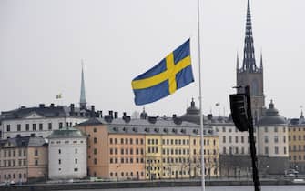 epa05900906 A Swedish flag at half mast at the official ceremony at Stockholm City Hall, in Stockholm, Sweden, 10 April 2017. The members of the Swedish Royal family are joining politicians and members of the public for a one minute of silence at the official ceremony, at noon, to remember the victims of the terror attack on Drottninggatan, Stockholm, 07 April 2017.  EPA/ANDERS WIKLUND  SWEDEN OUT