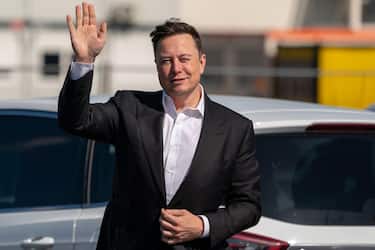 epa08643377 Tesla and SpaceX CEO Elon Musk waves while arriving for a statement at the construction site of the Tesla Giga Factory in Gruenheide near Berlin, Germany, 03 September 2020. Musk visited the German medical company Curevac in Tuebingen on 01 September 2020. Media report Musk will meet the German Economy Minister for talks. In June 2020, the German state invested 300 million euros in the vaccine developer Curevac and received 23 percent of the company's shares in return.  EPA/ALEXANDER BECHER