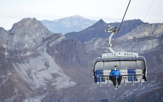 A skier wearing a medical face mask takes the 'Ice Flyer' chairlift on the Titlis, 10 November 2020, in Switzerland (issued 11 November 2020). Masks must be worn on all chairlifts, ski lifts and cableways in the ski area at times of Covid-19, Coronavirus pandemic.  ANSA/ALEXANDRA WEY