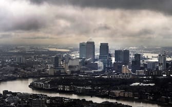epa05176875 (FILE) A file photo dated 01 February 2013 shows dark clouds above London's financial heart, Canary Wharf, in London, Britain. A group of more than 100 leaders of major businesses on 23 February 2016 backed Prime Minister David Cameron's campaign for Britain to remain in the European Union, saying a British exit, or Brexit, would 'deter investment and threaten jobs.' 'Business needs unrestricted access to the European market of 500 million people in order to continue to grow, invest and create jobs,' the business leaders said in a letter published in the Times. 'We believe that leaving the EU would deter investment, threaten jobs and put the economy at risk,' the letter read. The nearly 200 signatories included top executives from 36 companies listed on London's FTSE 100 index.  EPA/ANDY RAIN