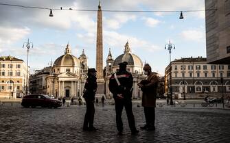 Italian Carabinieri police officers carry out checks in the Piazza del Popolo during the new lockdown for emergency of the Coronavirus Covid-19 pandemic in Rome, Rome, Italy, 20 March 2021. ANSA/ANGELO CARCONI