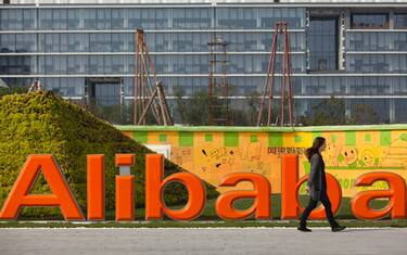 epa09125870 (FILE) - An employee walks past a logo of Alibaba Group at its headquarters on the outskirts of Hangzhou, Zhejiang province, China, 04 November 2013 (reissued 10 April 2021). China's State Administration for Market Regulation (SAMR) on 10 April fined Alibaba with 2.8 billion US dollar, accusing the company of monopolistic practices.  EPA/JEFF LEE
