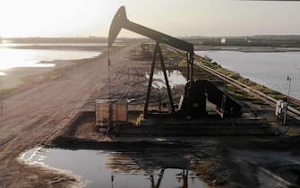 US-OIL-PRICES-TRADE-IN-NEGATIVE-NUMBERS-FOR-FIRST-TIME-AMID-GLOB HUNTINGTON BEACH, CA - APRIL 20: An aerial view shows an oil pumpjack at the Huntington Beach Oil Fields amidst the coronavirus pandemic on April 20, 2020 in Huntington Beach, California. Oil prices traded in negative territory for the first time as the spread of coronavirus (COVID-19) impacts global demand. Mario Tama/Getty Images/AFP
== FOR NEWSPAPERS, INTERNET, TELCOS & TELEVISION USE ONLY ==
