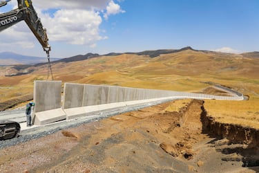 VAN, TURKEY - JULY 17: A view of a the 3-kilometer section of the 63-kilometer modular concrete wall, which was started to be built on the Iranian border line in order to prevent illegal immigration, smuggling activities and prevent PKK, (listed as a terrorist organization by Turkey, the U.S. and the EU), from infiltrating the country in Van, Turkey on July 17, 2021. (Photo by Mesut Varol/Anadolu Agency via Getty Images)