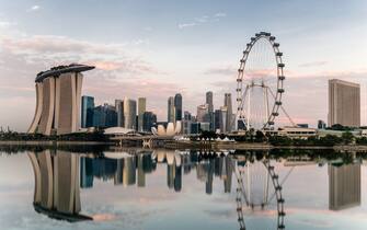 Singapore skyline at dawn, showing the Marina Bay Sands and the Flyer.