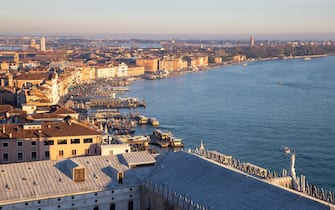 VENICE, ITALY - DECEMBER 12: A general view from Venice, Italy on December 12, 2021. Venice, the famous city of Italy for its water channels, which is on the UNESCO world heritage list, welcomes its visitors. Transportation in the city, which is built on 118 islands separated by canals and connected by bridges, is provided by sea taxis and gondolas. Tourists who come to visit the city enjoy the scenery by joining the gondola tour in the water channels surrounding the houses, which are almost standing on the water, as well as the historical texture. (Photo by Utku Ucrak/Anadolu Agency via Getty Images)