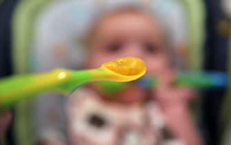 A nine month old baby girl at meal time. Photo Tim Clayton (Photo by Tim Clayton/Corbis via Getty Images)