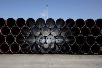 Pipe sections for the Trans Adriatic gas pipeline sit on the dockside at the cargo port of Alexandroupolis, Greece, on Feb. 23, 2017. The Trans Adriatic Pipeline AG (TAP) will transport Caspian natural gas to Europe crossing Northern Greece, Albania and the Adriatic Sea coming ashore in Southern Italy to connect the Italian gas network to the Trans Anatolian Pipeline (TANAP). Photographer: Konstantinos Tsakalidis/Bloomberg via Getty Images