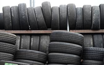Tires are stacked atop each other outside a tire repair shop in the New York City borough of Queens, in New York, NY, August 19, 2020. President Donald Trump called for a boycott of Goodyear tires after it was reported that the company has banned the wearing of any politically affiliated slogans, including “MAGA” hats. (Anthony Behar/Sipa USA)