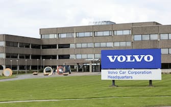 A sign sits at the entrance to the headquarters of Volvo Car Group in Torslanda, Sweden, on Wednesday, May 18, 2016. Volvo Car Group, known for its sturdy wagons and sport utility vehicles, will start rolling out a series of compact models next year to compete with the likes of Audi and BMW for lure younger, urban consumers. Photographer: Johan Jeppsson/Bloomberg