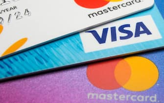 POLAND - 2020/01/03: In this photo illustration a Visa credit card and Mastercard debit cards are seen displayed. (Photo Illustration by Karol Serewis/SOPA Images/LightRocket via Getty Images)