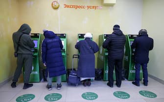 MOSCOW, RUSSIA - FEBRUARY 28, 2022: People use Sberbank ATM machines. On February 24, the United States announced it was imposing sanctions on major Russian banks, including Sberbank and VTB in response to the special military operation in Ukraine. According to the Sberbank press office, the bank continues to operate normally, with all transactions associated with mortgages and foreign securities available. Anton Novoderezhkin/TASS/Sipa USA