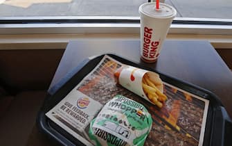 epa07803296 A posed photo shows an Impossible Whopper meal at a Burger King restaurant in Sulphur Springs, Texas, USA, 29 August 2019. Burger King has added a meatless burger called the Impossible Whopper to its menu.  EPA/LARRY W. SMITH
