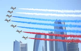 ABU DHABI, UNITED ARAB EMIRATES - OCTOBER,15 (RUSSIA OUT) UAE's jet fighters fliy over  the Gasr Al Watan Palace with smoke in colours of Russian flag honour the arrival of Russian President Putin in Abu Dhabi, United Arab Emirates, October,15,2019. Vladimir Putin is having a two-days visit to Saudi Arabia and UAE. (Photo by Mikhail Svetlov/Getty Images)