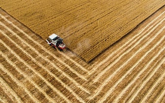 June 10, 2020 - Aerial photo taken on June 10, 2020 shows a reaper harvesting wheat in a field in Mahui Village of Datong Town in Wu'an City, north China's Hebei Province. (Credit Image: © Wang Xiao/Xinhua via ZUMA Wire)