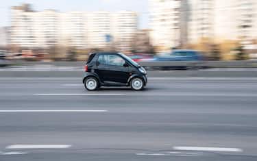 Ukraine, Kyiv - 4 April 2021: Black smart Fortwo car moving on the street. Editorial