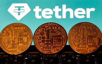 Tether cryptocurrency logo displayed on a phone screen and representation of cryptocurrency are seen in this illustration photo taken in Krakow, Poland on November 2, 2021. (Photo by Jakub Porzycki/NurPhoto via Getty Images)
