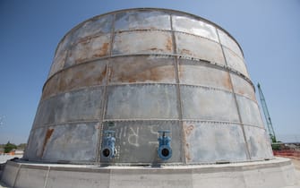 A gas storage tank stands the construction site of the Trans Adriatic Pipeline receiving terminal in Melendugno, Italy, on Tuesday, May 22, 2018. The Trans-Adriatic Pipeline, known as TAP, is a a 4.5 billion-euro ($5.2 billion) natural gas pipeline that will bring gas from Azerbaijan, winding through Greece and Albania, under the Adriatic Sea and finally up into Italy, which imports more than 90 percent of its oil and gas. Photographer: Giulio Napolitano/Bloomberg