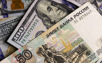 Money: 100 US Dollar and 50 Russian Ruble Banknotes