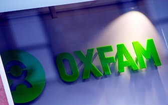 The logo on the front of an Oxfam bookshop is photographed in Glasgow on February 10, 2018. 
The British Government announced late on February 9 it was reviewing all work with Oxfam amid revelations the charity's staff hired prostitutes in Haiti during a 2011 relief effort on the earthquake-hit island. / AFP PHOTO / Andy Buchanan        (Photo credit should read ANDY BUCHANAN/AFP via Getty Images)