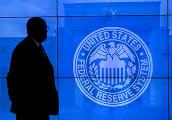 A man stands prior to a press conference by Federal Reserve Chair Janet Yellen in Washington, DC, March 16, 2016. - Almost no one expects the Federal Reserve to announce another interest rate hike on Wednesday, but all eyes are focused on whether the US central bank turns more bullish in its outlook. (Photo by SAUL LOEB / AFP) (Photo by SAUL LOEB/AFP via Getty Images)