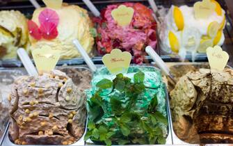 Gelato ice cream shop selling mint, hazlenut, coffee, lemon, strawberry flavours in Siena, Italy
