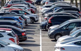 Facing car parking outside on a sunny day