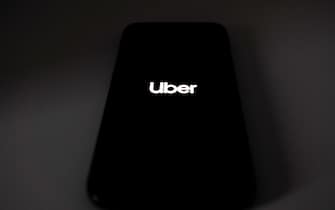 Uber Technologies Inc. app is seen on a smartphone in London, November 25, 2019. Uber lost its license in London for the second time in less than three years, putting one of its biggest markets outside of the U.S. at risk after the transport regulator said it failed to address safety concerns. (Photo by Alberto Pezzali/NurPhoto via Getty Images)