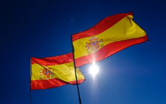 Pro-Spain demonstrators wave Spanish national flags in Colon Square during a protest for Spanish unity in Madrid, Spain, on Saturday, Oct. 28, 2017. The regional economy of Catalan, which accounts for about a fifth of Spanish gross domestic product, is under threat as more companies up sticks amid the threat of civil unrest (Photo by Oscar Gonzalez/NurPhoto via Getty Images)