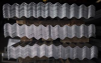 Corrugated roofing sheets stacked at the Sotral-CI steel and aluminum processing company, part of the Yeshi Group, in the Yopougon industrial district of Abidjan, Ivory Coast, on Thursday, May 19, 2022. Yeshi Group is parent to twenty companies across seven African nations. Photographer: Andrew Caballero-Reynolds/Bloomberg